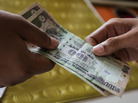 The Indian rupee has fallen nearly 16 percent against the dollar since May. The drop comes amid a slowdown in the country's economy. India's troubles are mirrored in other emerging economies that drove global growth for the past decade. The Indian rupee has fallen nearly 16 percent against the dollar since May. The drop comes amid a slowdown in the country's economy. India's troubles are mirrored in other emerging economies that drove global growth for the past decade.