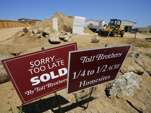 Toll Brothers luxury homes are shown sold before construction is completed in Oceanside, Calif. On Wednesday, Toll Brothers reported a 24 percent jump in quarterly revenue due to higher home prices. (Image credit: Reuters /Landov)