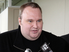 Megaupload boss Kim Dotcom, left, leaves court after he was granted bail in the in Auckland, New Zealand. Megaupload boss Kim Dotcom, left, leaves court after he was granted bail in the in Auckland, New Zealand.
