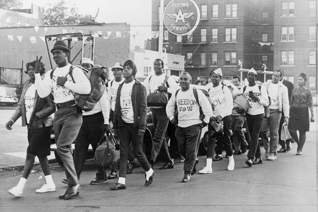 Members of the Congress of Racial Equality leaving Brooklyn en route to the March on Washington, on April 15, 1963. At 16, Lawrence Cumberbatch (fourth from left, in back wearing a white hat) was the group's youngest member. (Image credit: World Telegram & Sun/Library of Congress)
