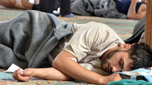 A survivor from what activists say was a chemical weapons attack rests inside a mosque in the Duma neighborhood of Damascus, Syria, on Wednesday.