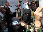 Female rebel fighters gather in Syria's northern city of Aleppo on Saturday to protest what they claim was a chemical attack by pro-government forces in a suburb of Damascus. Female rebel fighters gather in Syria's northern city of Aleppo on Saturday to protest what they claim was a chemical attack by pro-government forces in a suburb of Damascus.