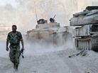 In this photo taken on a government organized media tour, a Syrian army soldier walks on a street in the Jobar neighborhood of Damascus, Syria, on Saturday. In this photo taken on a government organized media tour, a Syrian army soldier walks on a street in the Jobar neighborhood of Damascus, Syria, on Saturday.