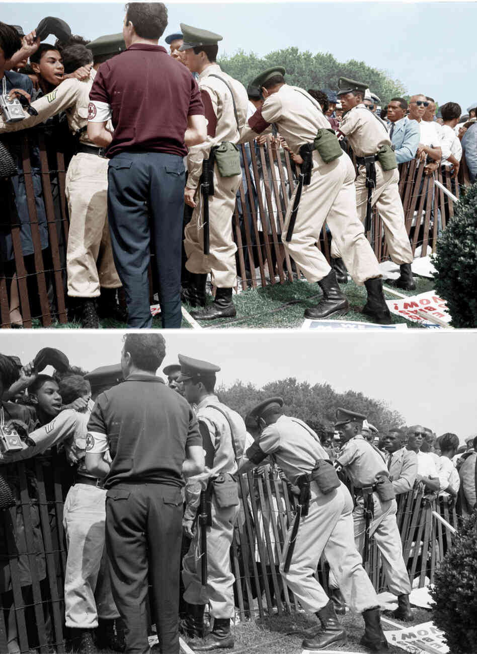 A storm fence guarded by police. Colorized by Patty Allison. A storm fence guarded by police. Colorized by Patty Allison.