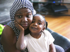 Carmesha Rogers snuggles with her 4-year-old daughter, Kasharee, on Aug. 22, in Muskegon, Mich. Rogers sustained a gunshot wound to the head on July 9 after removing several neighborhood children from a gunbattle's line of fire. Rogers says her only thought was: "Just get the kids out the way. 'Cause I'd want someone to do that for my kids." Carmesha Rogers snuggles with her 4-year-old daughter, Kasharee, on Aug. 22, in Muskegon, Mich. Rogers sustained a gunshot wound to the head on July 9 after removing several neighborhood children from a gunbattle's line of fire. Rogers says her only thought was: "Just get the kids out the way. 'Cause I'd want someone to do that for my kids."