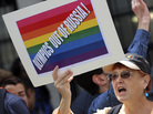 A gay-rights activist chants slogans during a demonstration in front of the Russian Consulate in New York on July 31. Gays in the United States and elsewhere are outraged by Russia's intensifying campaign against gay-rights activism. A gay-rights activist chants slogans during a demonstration in front of the Russian Consulate in New York on July 31. Gays in the United States and elsewhere are outraged by Russia's intensifying campaign against gay-rights activism.