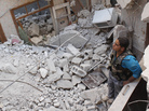 In Aleppo, Syria, on Monday, this Free Syrian Army fighter stood in the rubble of a building that has collapsed during fighting there. In Aleppo, Syria, on Monday, this Free Syrian Army fighter stood in the rubble of a building that has collapsed during fighting there.