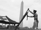 National Guardsman Burton Johnson set up a cot at a first aid station ahead of the March on Washington. National Guardsman Burton Johnson set up a cot at a first aid station ahead of the March on Washington.