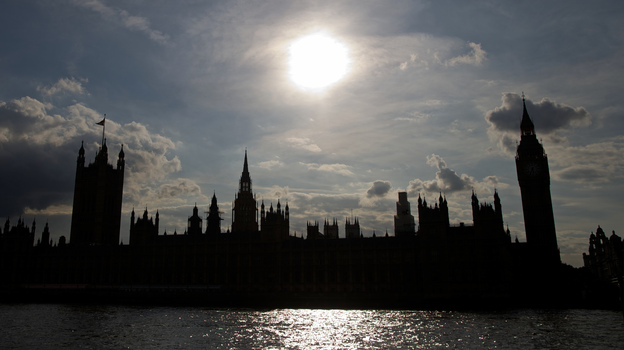 The Houses of Parliament are silhouetted against a setting sun as lawmakers debate possible British military action in Syria. (AFP/Getty Images)