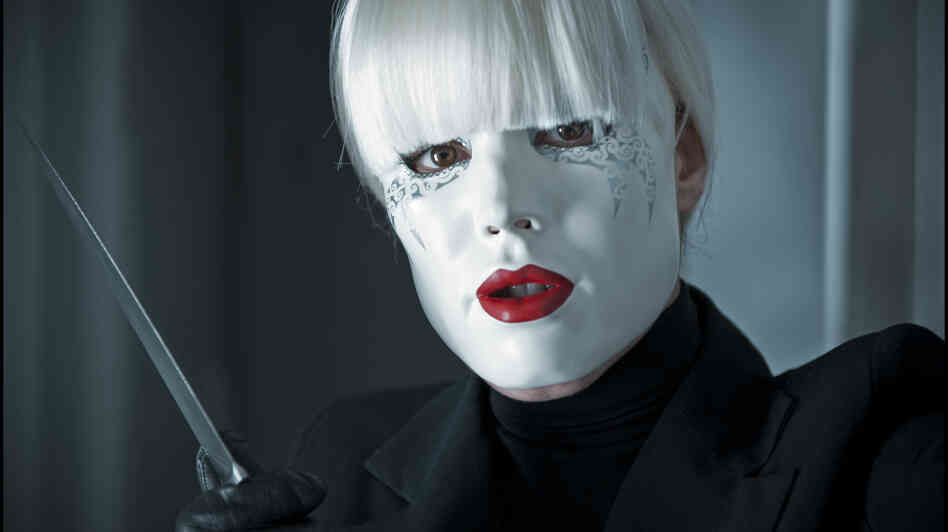 Is that Noomi Rapace's Isabelle behind the mask (and the knife)? Could be. Probably is. Passion is nothing if not a genre flick — though genre films do come with their twists. Is that Noomi Rapace's Isabelle behind the mask (and the knife)? Could be. Probably is. Passion is nothing if not a genre flick — though genre films do come with their twists.