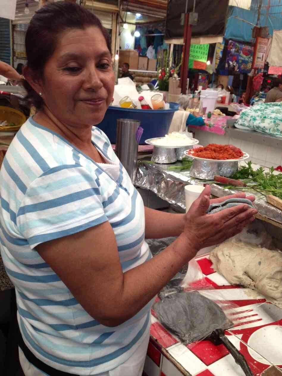 Isabel Salazar Cabrera says her tlacoyos are the best because of the way she cooks the bean filling. She says her mom was the first to ever sell tlacoyos in Xochimilo, a suburb in southern Mexico City. Isabel Salazar Cabrera says her tlacoyos are the best because of the way she cooks the bean filling. She says her mom was the first to ever sell tlacoyos in Xochimilo, a suburb in southern Mexico City.