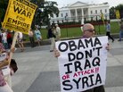 Demonstrators march in protest during a rally against a possible U.S. attack on Syria. Demonstrators march in protest during a rally against a possible U.S. attack on Syria.