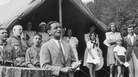 American composer Irving Berlin sings his song "God Bless America" in front of Boy Scouts troop members and spectators gathered at a tent in Monticello, New York in 1940. Instead of collecting royalties from "God Bless America," Berlin created a fund that collected and distributed them to the Boy and Girl Scouts. American composer Irving Berlin sings his song "God Bless America" in front of Boy Scouts troop members and spectators gathered at a tent in Monticello, New York in 1940. Instead of collecting royalties from "God Bless America," Berlin created a fund that collected and distributed them to the Boy and Girl Scouts.