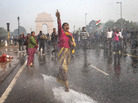A protester in India chants slogans as she braces herself against the spray fired from police water canons during a protest in December sparked by the gang rape of a 23-year-old paramedical student. A protester in India chants slogans as she braces herself against the spray fired from police water canons during a protest in December sparked by the gang rape of a 23-year-old paramedical student.
