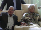 In an image taken from video, South African President Jacob Zuma, left, sits with the ailing anti-apartheid icon Nelson Madela in April. In an image taken from video, South African President Jacob Zuma, left, sits with the ailing anti-apartheid icon Nelson Madela in April.