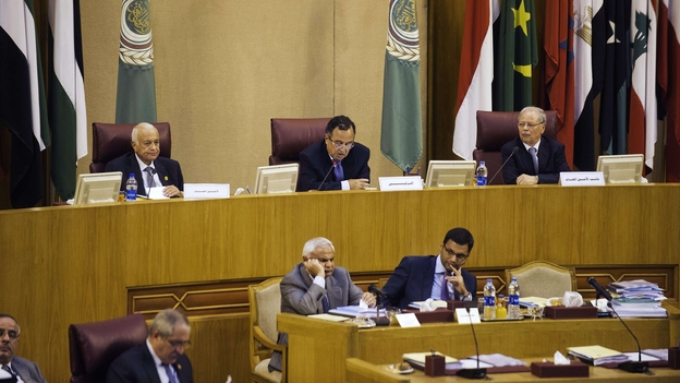 Arab League Secretary General Nabil Al Arabi (L) and Egypt Foreign Affairs minister Nabil Fahmi (C) head a meeting of the Arab League at the body's Cairo headquarters on Sunday. (Image credit: AFP/Getty Images)