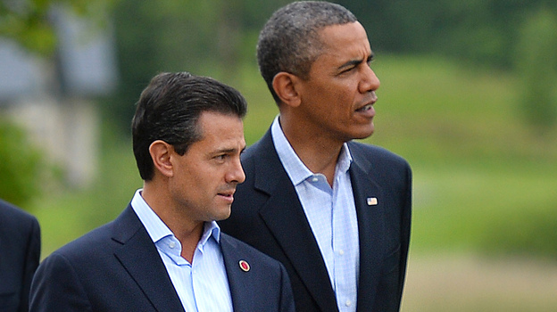 New reports allege that the NSA spied on Mexican President Enrique Pena Nieto, seen here walking with President Barack Obama in June, when he was a candidate for office. Mexico and Brazil have demanded a response to charges of U.S. spying on their internal affairs. (AFP/Getty Images)