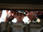 Afghan soldiers and contractors are taught about the workings of a diesel-powered electrical generator at Forward Operating Base Nolay in Helmand province. Afghan soldiers and contractors are taught about the workings of a diesel-powered electrical generator at Forward Operating Base Nolay in Helmand province.