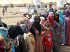 Syrian refugees stand in line for food at Kawergost refugee camp in Irbil, Iraq, on Aug. 21. The Syrian civil war has already sparked a refugee crisis in the region. Now, many countries are waiting to see the effects of a possible U.S. military strike. Syrian refugees stand in line for food at Kawergost refugee camp in Irbil, Iraq, on Aug. 21. The Syrian civil war has already sparked a refugee crisis in the region. Now, many countries are waiting to see the effects of a possible U.S. military strike.