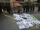 Security guards stand outside newspaper offices in Guangdong province in January, where banners and flowers were laid in protest of censorship. Security guards stand outside newspaper offices in Guangdong province in January, where banners and flowers were laid in protest of censorship.