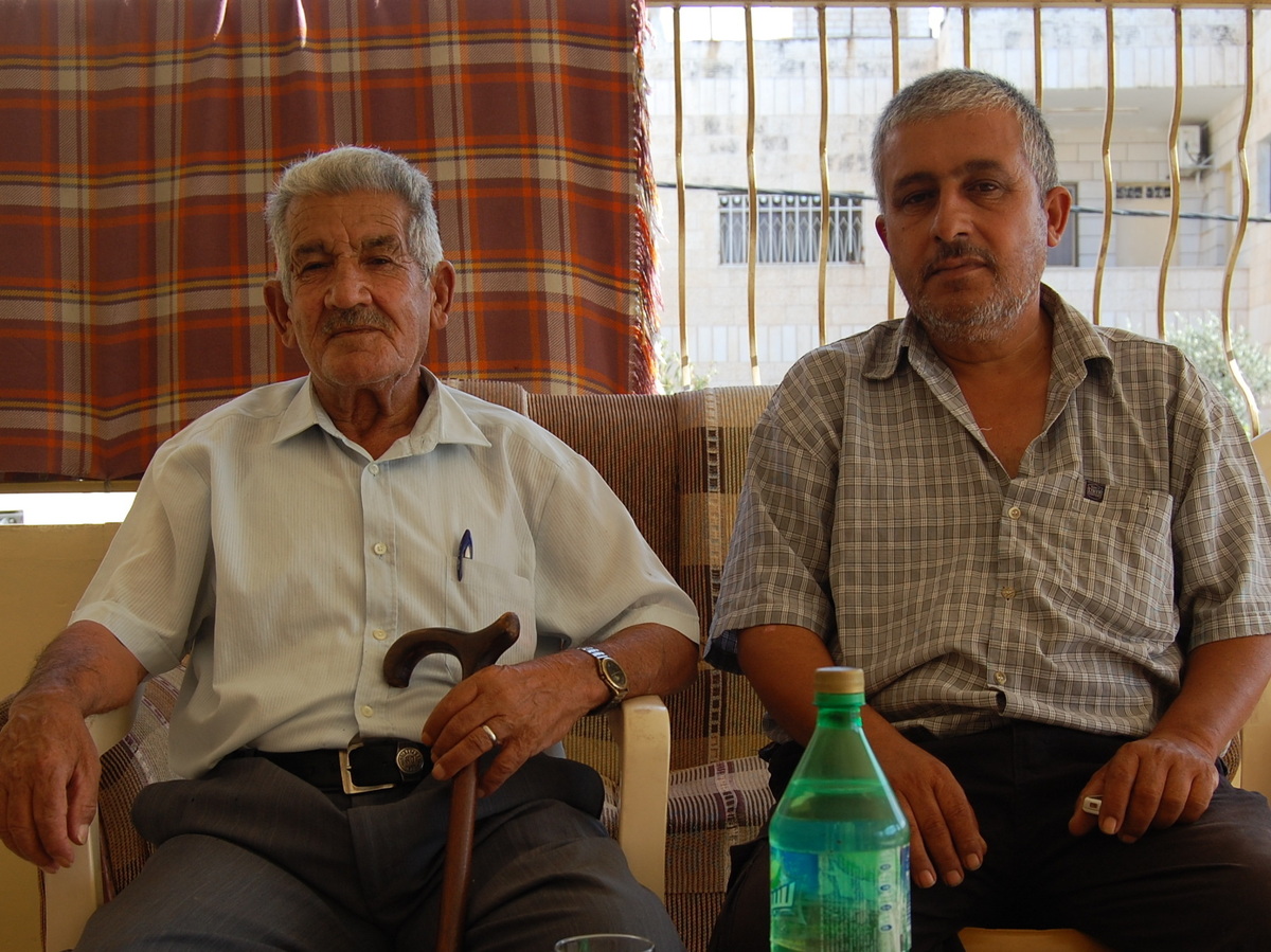 Ahmed al-Hurani, left, and his son, Bassam, live in the West Bank. Eleven members of their family living in Syria died in the chemical attack on Aug. 21.