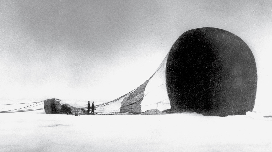 Members of S. A. Andrée's 1897 journey survey their downed vessel. This photo was recovered from a camera when their remains were found 33 years later.