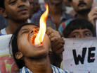 Fire breathing only makes it harder to talk: An activist with the Science and Rationalists' Association of India demonstrates against the claim that Mother Teresa performed a miracle in Calcutta. Fire breathing only makes it harder to talk: An activist with the Science and Rationalists' Association of India demonstrates against the claim that Mother Teresa performed a miracle in Calcutta.
