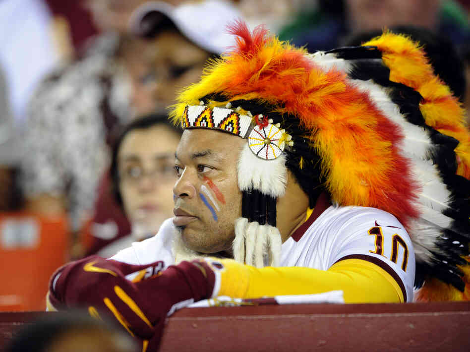 A Washington Redskins fan watches from the sidelines during the first half of an NFL preseason football game this August. A Washington Redskins fan watches from the sidelines during the first half of an NFL preseason football game this August.