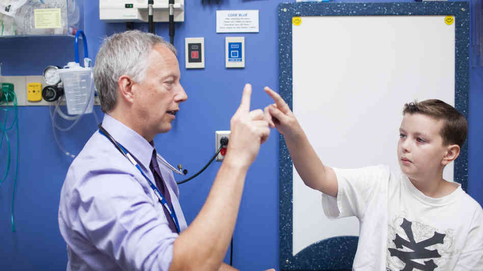 Dr. Jim Olson meets with Carver Faull at Seattle Children's Hospital in August. Carver, now 12, had surgery to remove a brain tumor in 2012. Dr. Jim Olson meets with Carver Faull at Seattle Children's Hospital in August. Carver, now 12, had surgery to remove a brain tumor in 2012.
