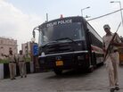 A police bus believed to be carrying the four men convicted for the December rape and murder. A police bus believed to be carrying the four men convicted for the December rape and murder.