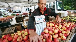 Ron Samascott with his local apples at the Union Square Greenmarket in New York. The city is teaming up with Wholesome Wave, hospitals and farm markets to pilot a fruit and vegetable prescription program.