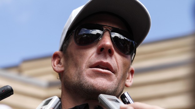 Lance Armstrong talks to the media after the 2011 Xterra Nationals triathlon in Utah. (AP)