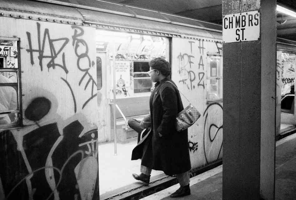 A passenger boards a subway car painted with graffiti, in New York in 1984. A passenger boards a subway car painted with graffiti, in New York in 1984.