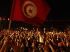 People gather outside the Constituent Assembly headquarters during a protest to demand the ouster of the Islamist-dominated government, in Tunis, Tunisia, on July 28. People gather outside the Constituent Assembly headquarters during a protest to demand the ouster of the Islamist-dominated government, in Tunis, Tunisia, on July 28.