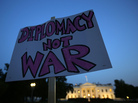 Protesters gather outside the White House on Tuesday before President Obama addressed the nation about the situation in Syria. Obama said he was asking Congress to delay authorizing a strike on Syria to allow a diplomatic plan to work. Protesters gather outside the White House on Tuesday before President Obama addressed the nation about the situation in Syria. Obama said he was asking Congress to delay authorizing a strike on Syria to allow a diplomatic plan to work.