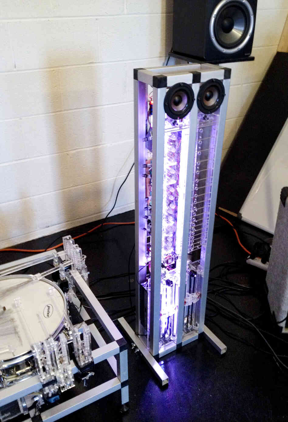 AMMI, a guitar-like robot, can play complicated tunes with only one string. It has two speakers that give it "eyes" and a personality. AMMI, a guitar-like robot, can play complicated tunes with only one string. It has two speakers that give it "eyes" and a personality.