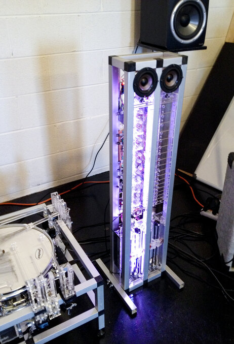 The robotic drum, MADI, can be configured with up to 15 arms. The guitar-like robot, AMMI, can play complicated tunes with only one string and has two speakers that give it a personality. The robotic drum, MADI, can be configured with up to 15 arms. The guitar-like robot, AMMI, can play complicated tunes with only one string and has two speakers that give it a personality.