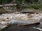 This home was stranded Thursday after a flash flood in Coal Creek destroyed a bridge near Golden, Colo. This home was stranded Thursday after a flash flood in Coal Creek destroyed a bridge near Golden, Colo.