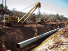A 60-foot section of pipe is lowered into a trench during construction of the Gulf Coast Pipeline in Prague, Okla., in March. The Gulf Coast Pipeline, a 485-mile crude oil line, is part of the Keystone XL project and will run from Cushing, Okla. to Nederland, Texas. Although this southern stretch of the pipeline is nearly finished, the northern stretch is still under study. A 60-foot section of pipe is lowered into a trench during construction of the Gulf Coast Pipeline in Prague, Okla., in March. The Gulf Coast Pipeline, a 485-mile crude oil line, is part of the Keystone XL project and will run from Cushing, Okla. to Nederland, Texas. Although this southern stretch of the pipeline is nearly finished, the northern stretch is still under study.