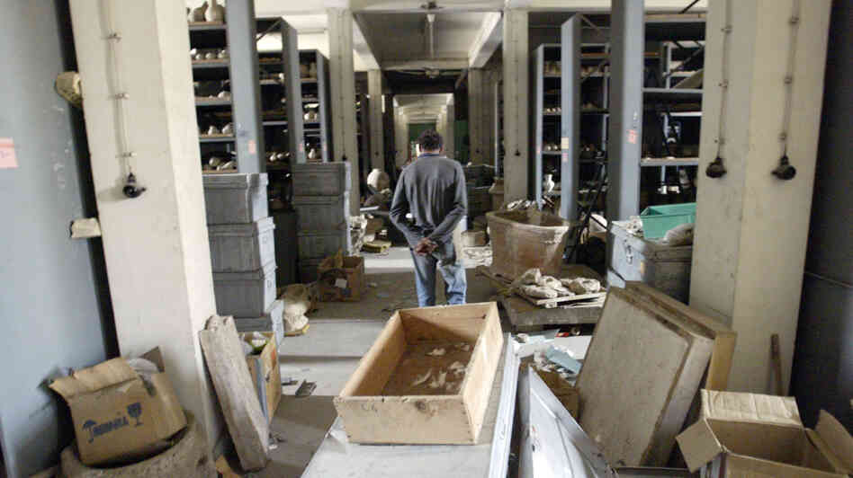 An Iraqi civilian walks through the vault of the National Museum in Baghdad, Iraq, on April 12, 2003. Looters opened the museum vault, went on a rampage breaking ancient artifacts stored there by museum authorities before the war started. An Iraqi civilian walks through the vault of the National Museum in Baghdad, Iraq, on April 12, 2003. Looters opened the museum vault, went on a rampage breaking ancient artifacts stored there by museum authorities before the war started.