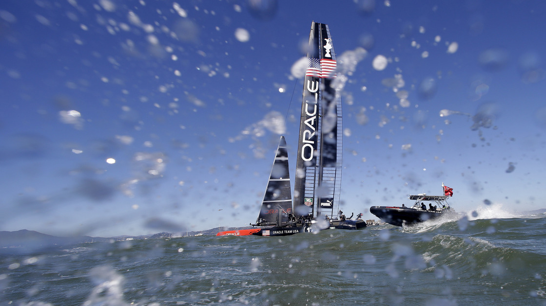 Oracle Team USA heads to the waterfront after winning the ninth race of the America's Cup with a 47-second victory over Emirates Team New Zealand.