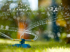A sprinkler on a lawn A sprinkler on a lawn