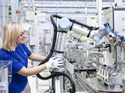 A robot arm helps make engine components at a Volkswagen factory in Germany. For the first time, robots are working alongside humans without guards or other safety barriers between them. A robot arm helps make engine components at a Volkswagen factory in Germany. For the first time, robots are working alongside humans without guards or other safety barriers between them.
