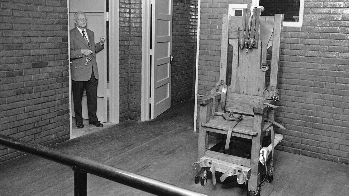 Execution witness Don Reid stands in the death chamber of the Texas State Penitentiary on July 31, 1972, where he officially watched 189 men die in the heavy oak electric chair. The Supreme Court struck down capital punishment on June 29 of that year.