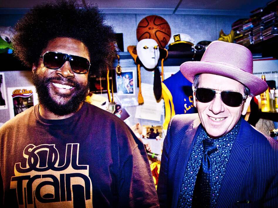 ?uestlove and The Roots play backing band to Elvis Costello on the new collaborative album Wise Up Ghost. ?uestlove and The Roots play backing band to Elvis Costello on the new collaborative album Wise Up Ghost.