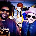 ?uestlove and The Roots play backing band to Elvis Costello on the new collaborative album Wise Up Ghost. ?uestlove and The Roots play backing band to Elvis Costello on the new collaborative album Wise Up Ghost.