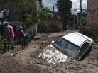 A car lays buried in mud after flooding triggered by Hurricane Manuel in Chilpancingo, Mexico. A car lays buried in mud after flooding triggered by Hurricane Manuel in Chilpancingo, Mexico.