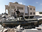 A Free Syrian Army soldier stands on a Syrian military tank in front of a damaged mosque in the Syrian town of Azaz in September 2012. A different rebel group, an al-Qaida offshoot, took over the town on Wednesday. A Free Syrian Army soldier stands on a Syrian military tank in front of a damaged mosque in the Syrian town of Azaz in September 2012. A different rebel group, an al-Qaida offshoot, took over the town on Wednesday.