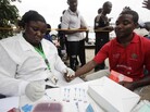 A doctor takes an HIV test from an athlete during the 18th National Sports Festival in Lagos, Nigeria, last December. A doctor takes an HIV test from an athlete during the 18th National Sports Festival in Lagos, Nigeria, last December.
