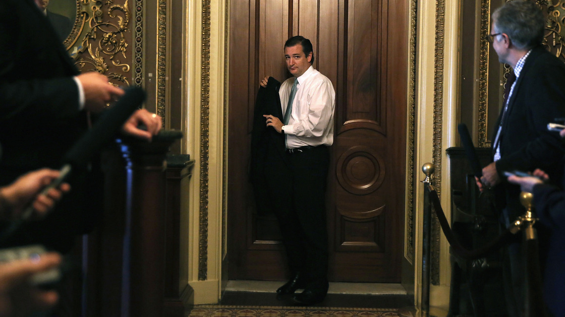 Texas Sen. Ted Cruz leaves the weekly Senate Republican Policy Committee luncheon Tuesday, shortly before beginning a filibuster against Obamacare.